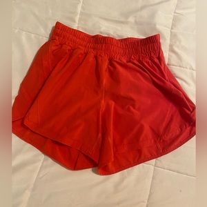 Lululemon red track that 5” shorts. Size 8. Great condition.